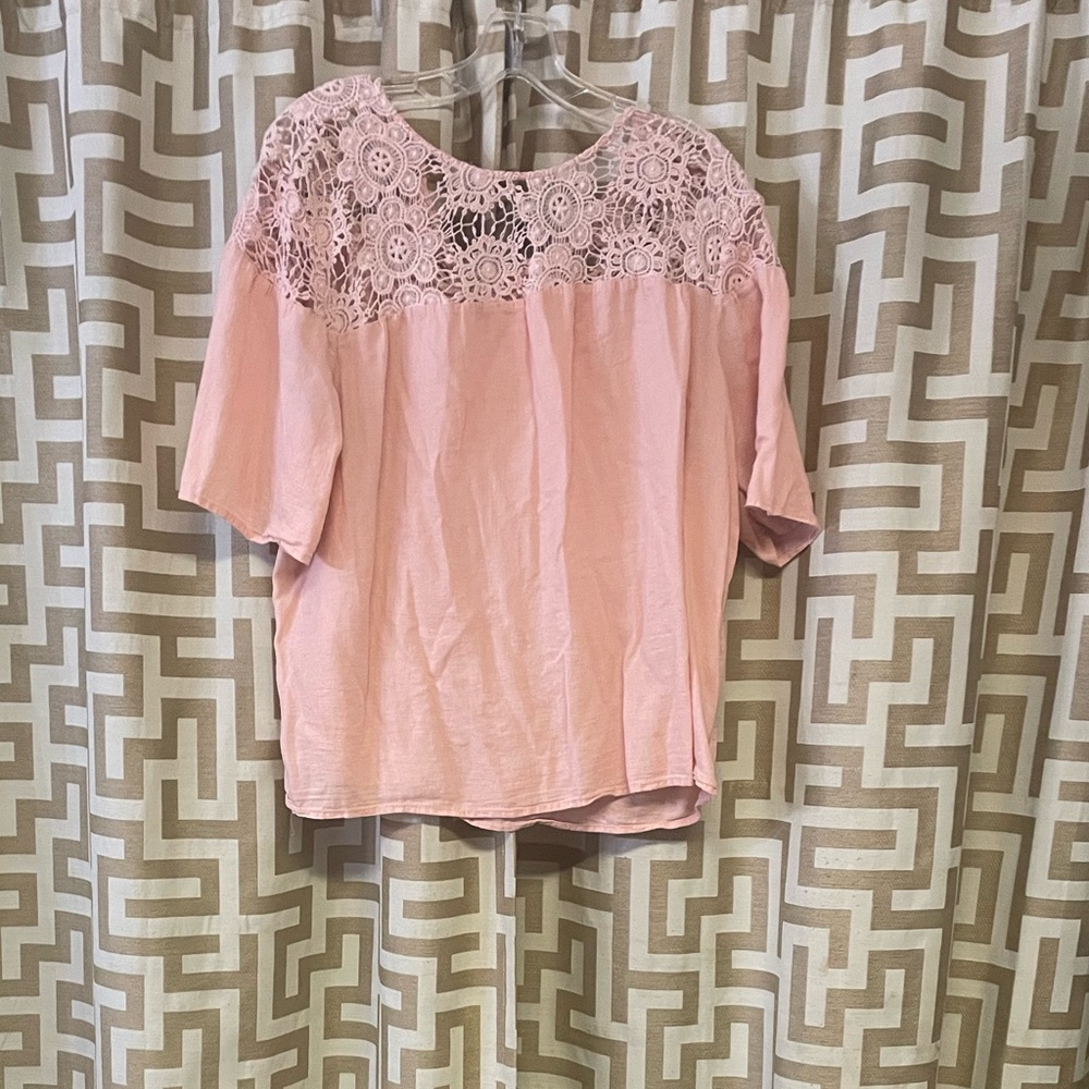 Pink short sleeve blouse.
